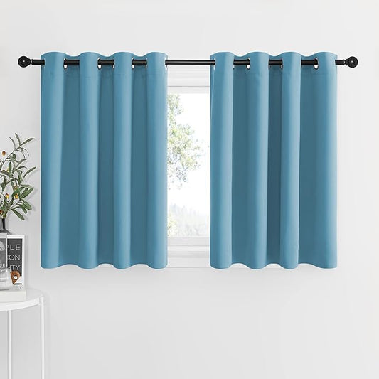 NICETOWN Blackout Window Curtains for Nursery - Eyelet Top Window Treatment Blackout Curtain Panels (Teal Blue=Light Blue, 2 PCs, W52 x L36 1.2 inches Header)