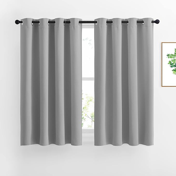 NICETOWN Bedroom Blackout Curtains Panels - Window Treatment Thermal Insulated Solid Grommet Vertical Drapes for Nursery (1 Pair, 52 by 54 Inch, Silver Grey)