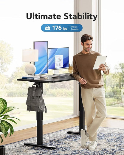 HUANUO Electric Standing Desk, 48" x 30" Whole Piece Desktop, Adjustable Height Computer Desk, 4 Height Memory Settings, Sit Stand Up Desk for Home Office, Black